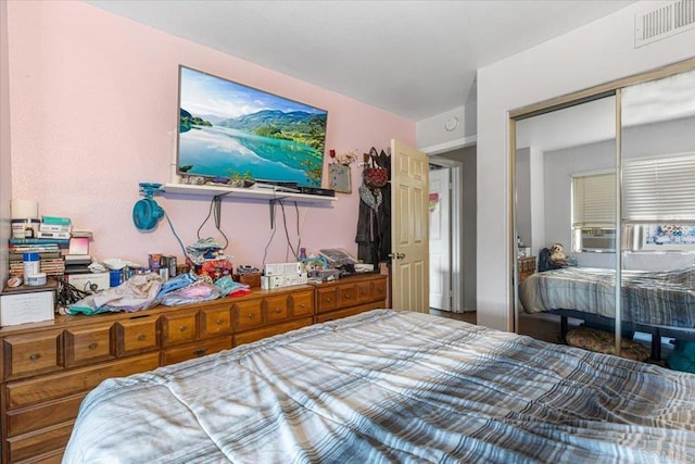 bedroom with visible vents and a closet