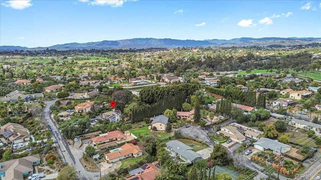 drone / aerial view featuring a mountain view and a residential view