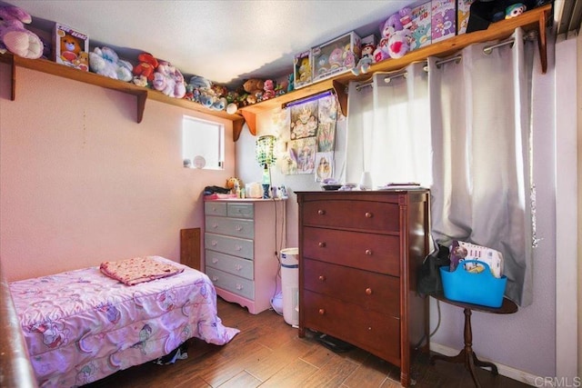 bedroom with wood finished floors