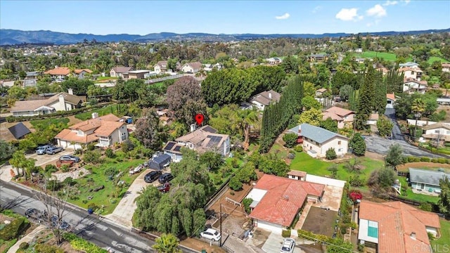 aerial view featuring a mountain view and a residential view