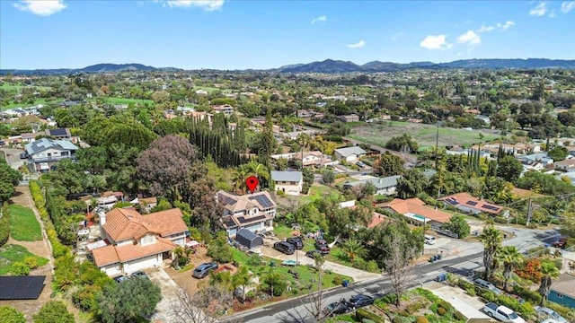 birds eye view of property with a residential view and a mountain view