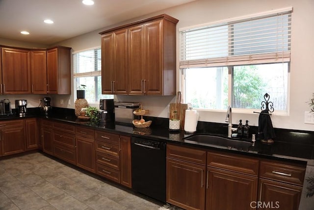 kitchen with a sink, black dishwasher, and recessed lighting