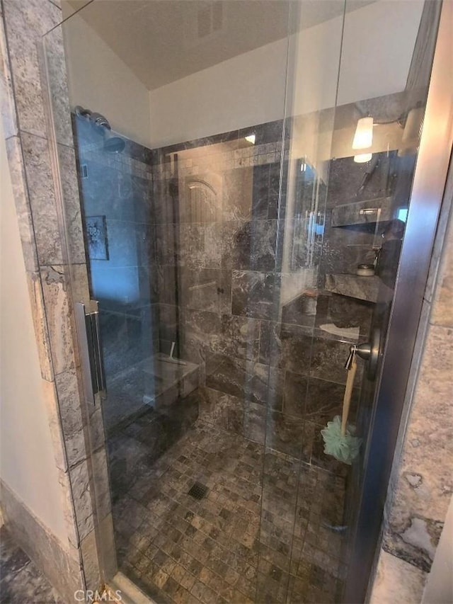 full bathroom with tiled shower