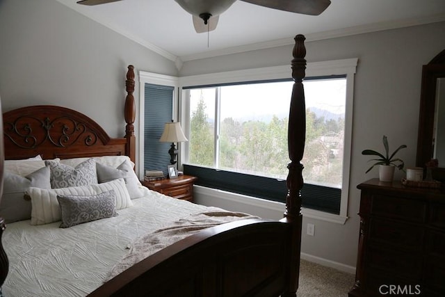 bedroom with baseboards, a ceiling fan, carpet flooring, and crown molding