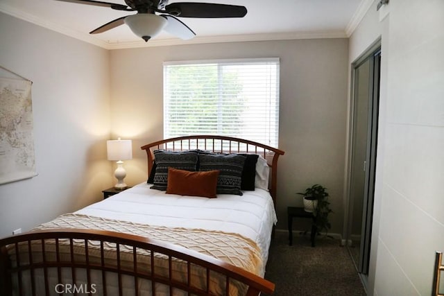 bedroom with a closet, ceiling fan, crown molding, and carpet