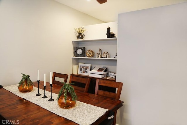 dining space with wood finished floors and a ceiling fan