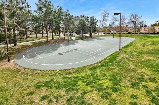 view of sport court featuring a yard and community basketball court