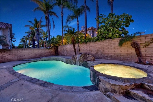 view of swimming pool with a fenced in pool, an in ground hot tub, and a fenced backyard