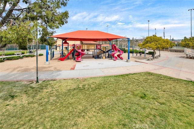 community jungle gym with a yard