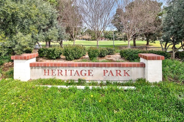 community sign with fence