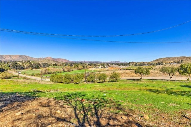 property view of mountains featuring a rural view