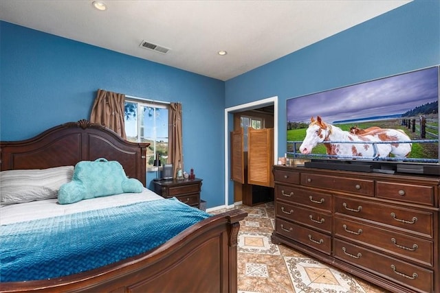 bedroom with recessed lighting, visible vents, and baseboards