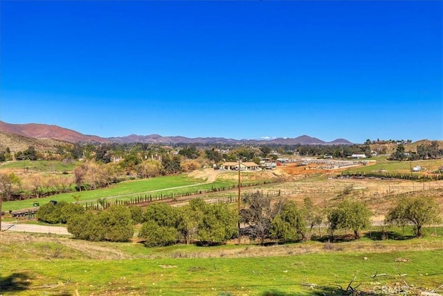 mountain view featuring a rural view