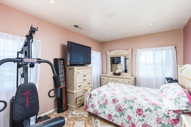 bedroom featuring light tile patterned floors, visible vents, and recessed lighting