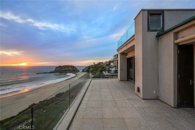 balcony with a beach view and a water view