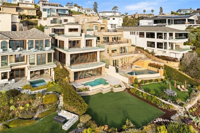 view of building exterior featuring a residential view and a community pool