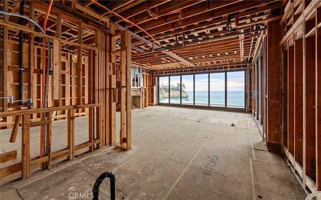 misc room with a view of the beach and a water view