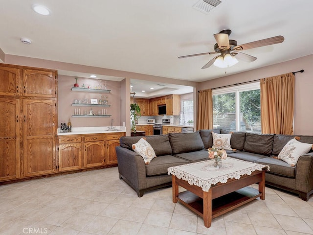 living room with visible vents, recessed lighting, and a ceiling fan