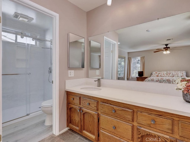 full bath featuring visible vents, a shower stall, toilet, and vanity