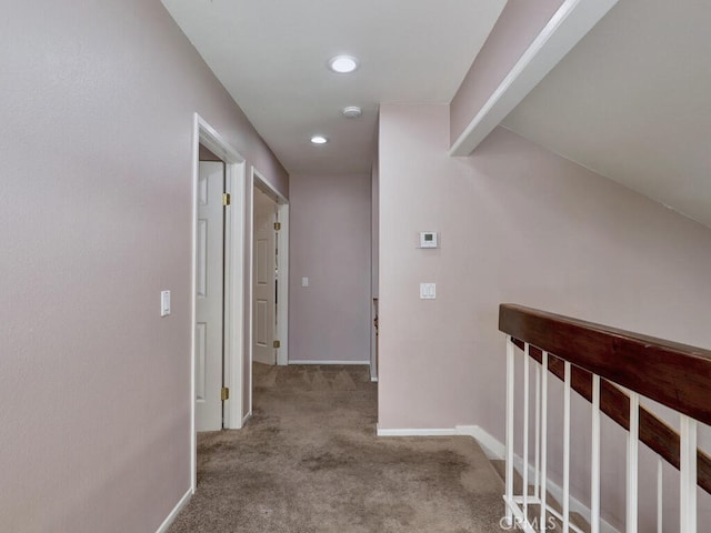 corridor with recessed lighting, baseboards, and carpet flooring