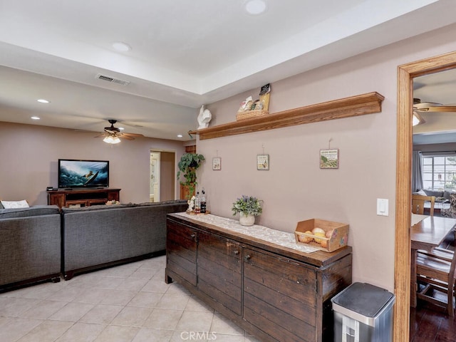 living area featuring light tile patterned floors, visible vents, recessed lighting, and ceiling fan