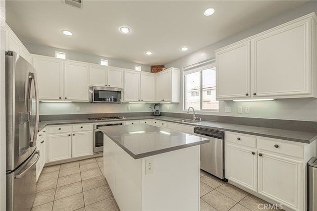 kitchen featuring a sink, stainless steel appliances, recessed lighting, and light tile patterned floors