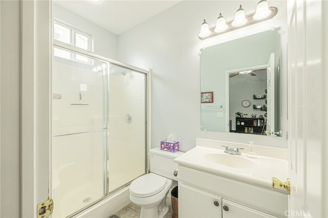 full bath featuring a shower stall, toilet, and vanity