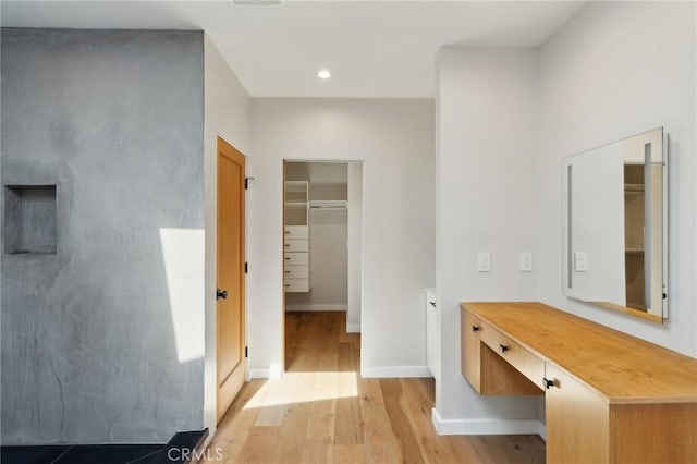 bathroom featuring recessed lighting, baseboards, and wood finished floors