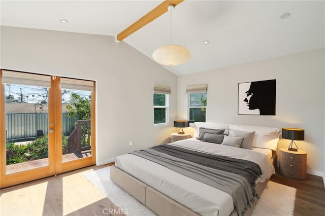 bedroom with access to outside, multiple windows, wood finished floors, and vaulted ceiling with beams