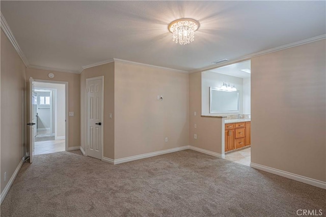 unfurnished room featuring baseboards, visible vents, ornamental molding, a notable chandelier, and light colored carpet