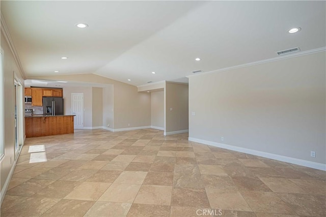 interior space with visible vents, baseboards, crown molding, and vaulted ceiling