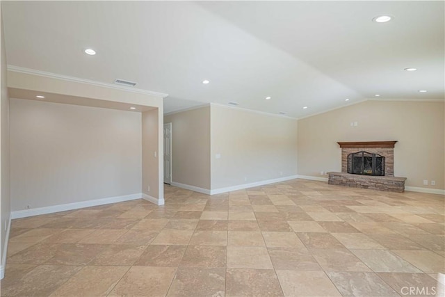 unfurnished living room with visible vents, a fireplace with raised hearth, crown molding, baseboards, and vaulted ceiling