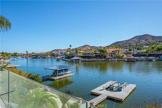 dock area with a water and mountain view