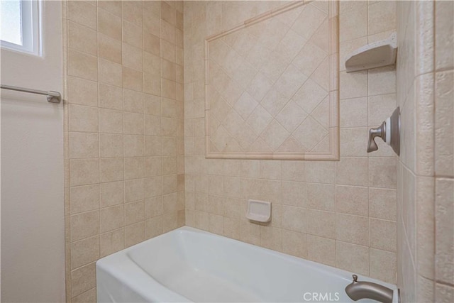 bathroom featuring walk in shower and a tub to relax in