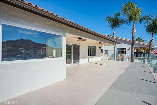 30360 Point Marina Dr, Canyon Lake, CA 92587 - view of swimming pool with fence, a ceiling fan, a pool, and a patio area