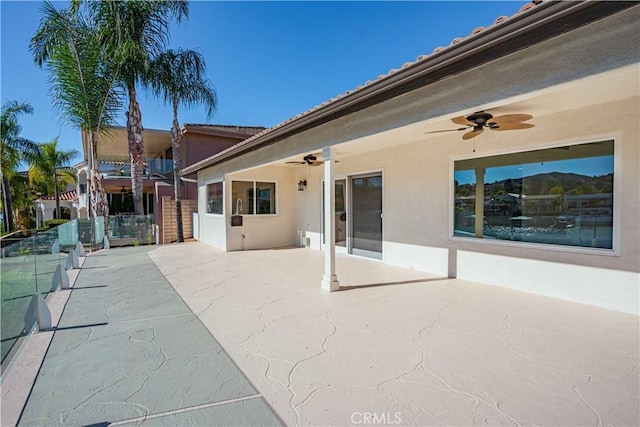 view of patio / terrace featuring a ceiling fan and fence