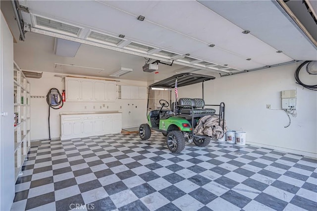 garage featuring a garage door opener