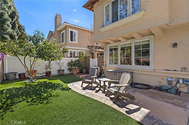 view of yard with a fenced backyard and a patio area