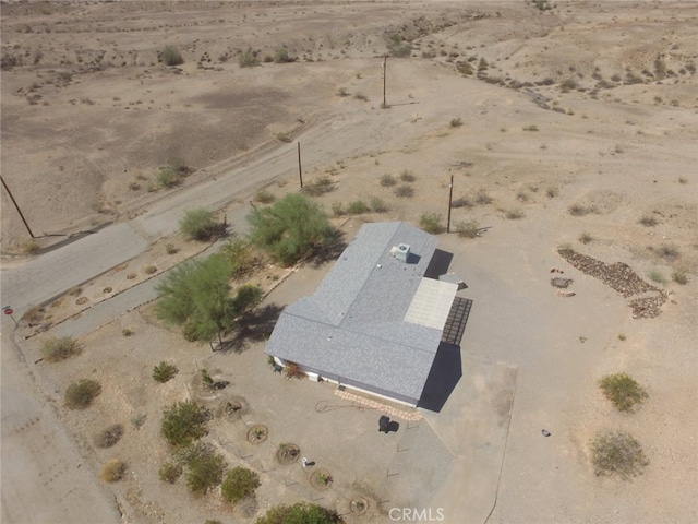 drone / aerial view with view of desert