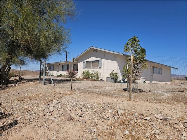 view of front facade featuring concrete block siding