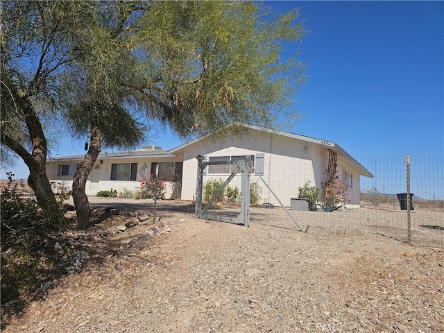 ranch-style home featuring concrete block siding