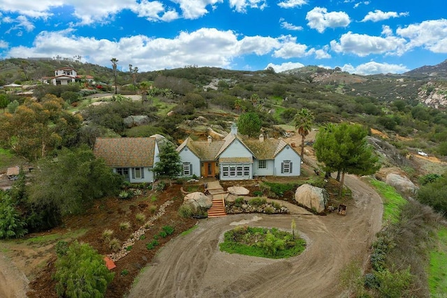 drone / aerial view featuring a mountain view