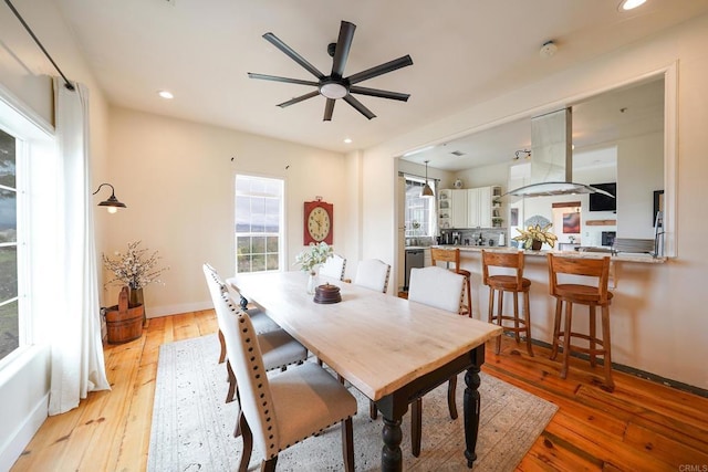 dining area with recessed lighting, baseboards, ceiling fan, and light wood finished floors