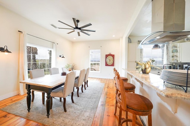 dining space with recessed lighting, a healthy amount of sunlight, light wood finished floors, and ceiling fan