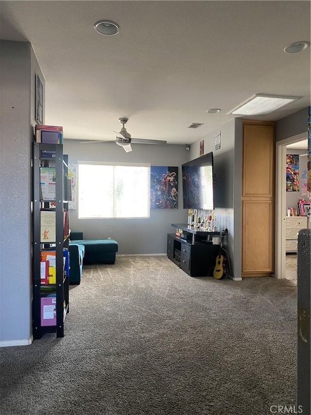 recreation room featuring visible vents, carpet floors, and ceiling fan