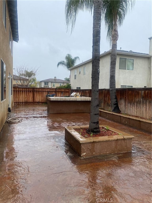 exterior space with a fenced backyard