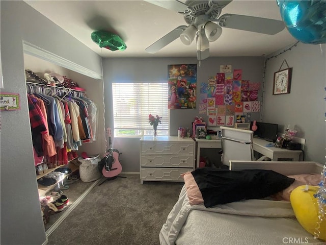 carpeted bedroom featuring a closet and ceiling fan