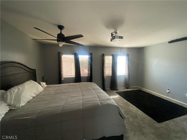 bedroom featuring carpet flooring, baseboards, and a ceiling fan