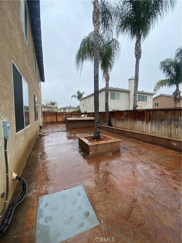 view of yard featuring a patio area and a fenced backyard