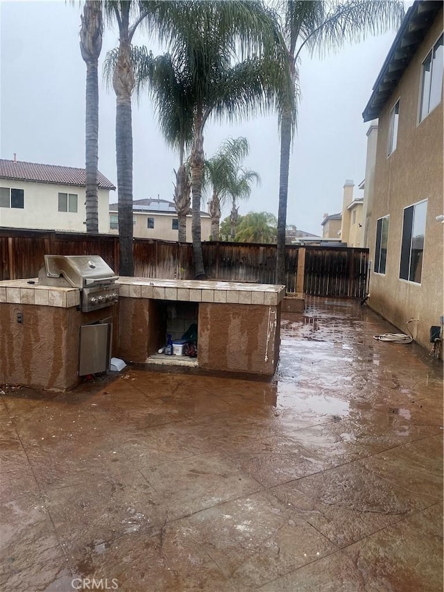 view of patio / terrace featuring area for grilling and a fenced backyard